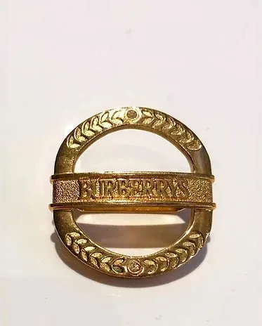 1980s BURBERRYS GOLD TONE METAL MEDALLION SCARF RING