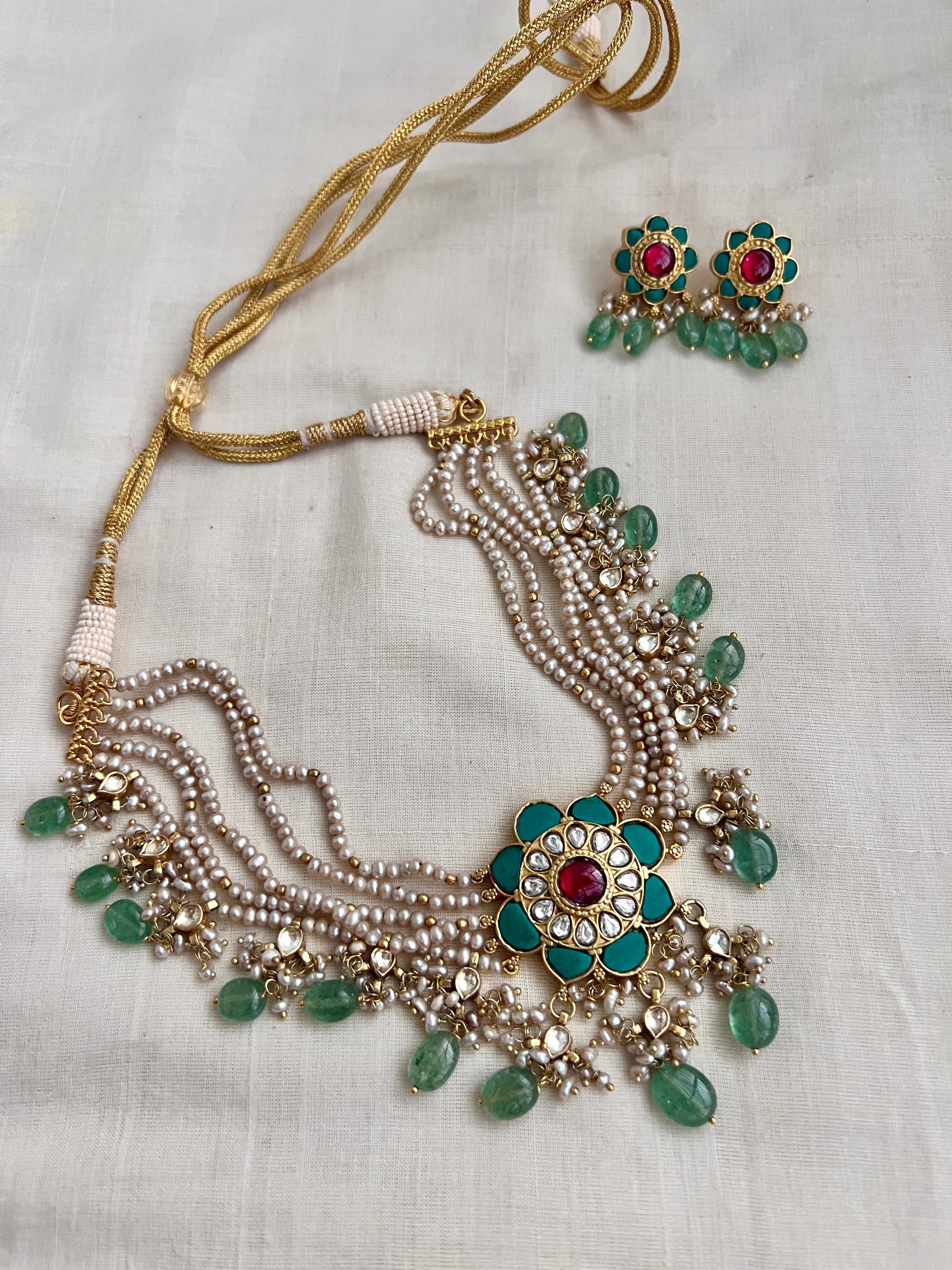 Gold polish kundan, ruby & turquoise choker set with pearls and jade beads
